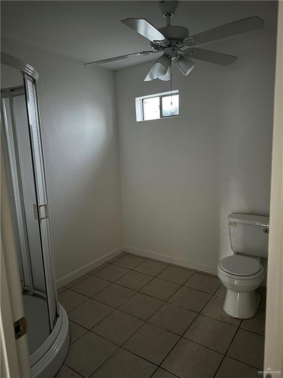 12517 North Taylor Road Mission, TX 78573 - Photo 20 of 22 a bathroom with a granite countertop toilet and a sink