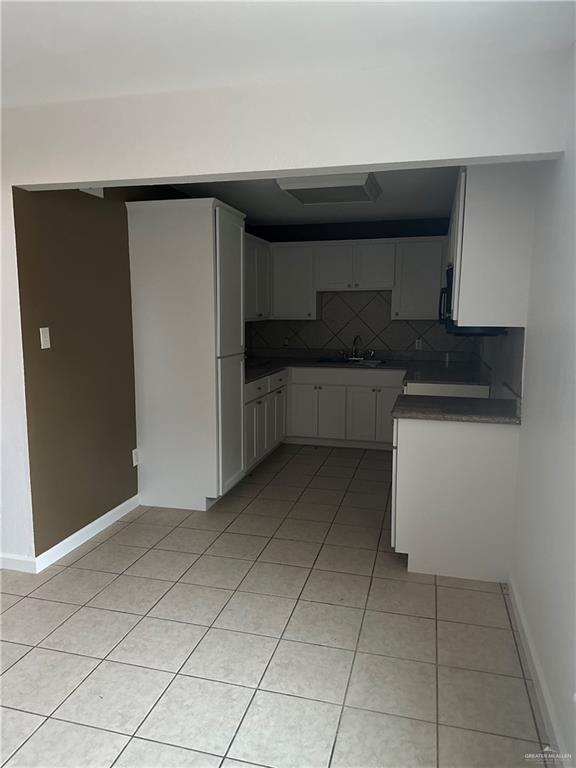 12517 North Taylor Road Mission, TX 78573 - Photo 8 of 22 a kitchen with a cabinets and a stove