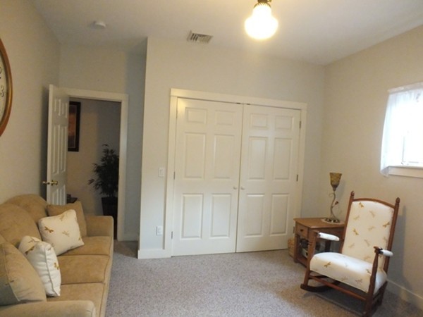 64 Wood Hill Road Monson, MA 01057 - Photo 11 of 30 a living room with furniture and a window