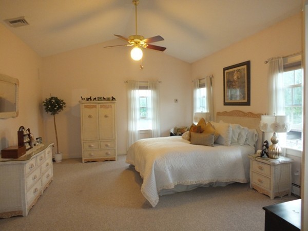 64 Wood Hill Road Monson, MA 01057 - Photo 15 of 30 a bedroom with a bed and a chandelier