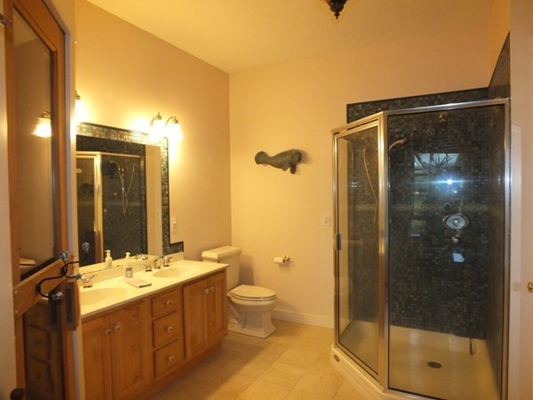 64 Wood Hill Road Monson, MA 01057 - Photo 18 of 30 a bathroom with a double vanity sink toilet and shower