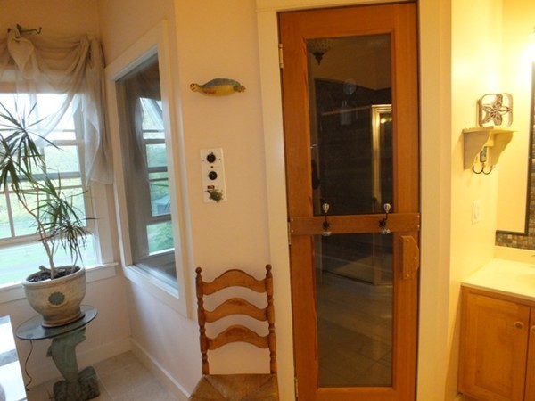 64 Wood Hill Road Monson, MA 01057 - Photo 19 of 30 a bathroom with a tub shower and a mirror