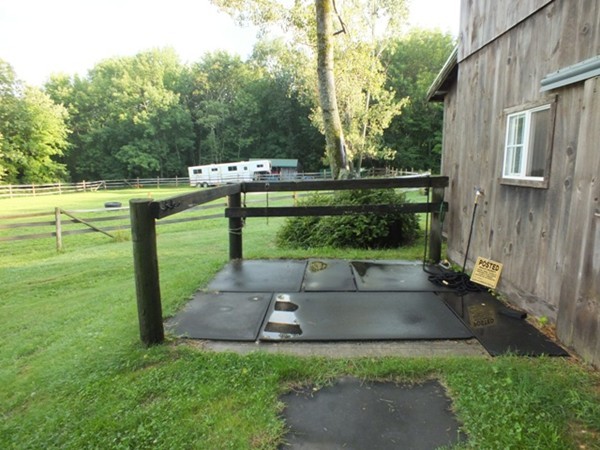 64 Wood Hill Road Monson, MA 01057 - Photo 27 of 30 a view of a patio with table and chairs potted plants with wooden floor and fence