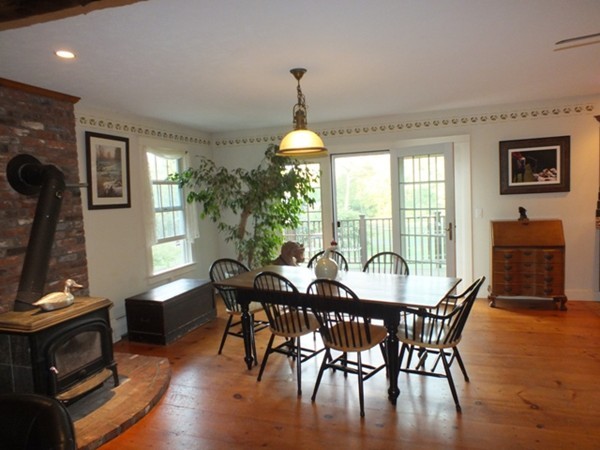 64 Wood Hill Road Monson, MA 01057 - Photo 4 of 30 a dining room with furniture window chandeliers and wooden floor