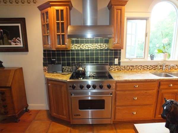 64 Wood Hill Road Monson, MA 01057 - Photo 6 of 30 a stove top oven sitting inside of a kitchen