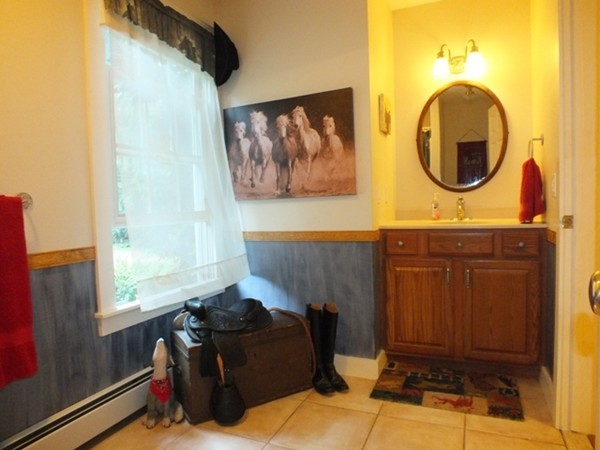 64 Wood Hill Road Monson, MA 01057 - Photo 9 of 30 a living room with furniture and a mirror