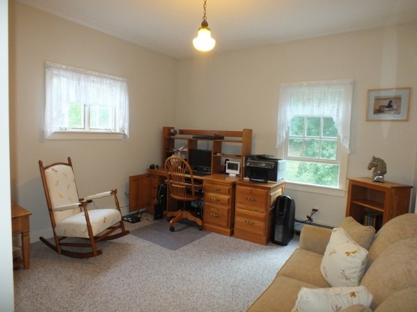 64 Wood Hill Road Monson, MA 01057 - Photo 10 of 30 a living room with furniture and a window