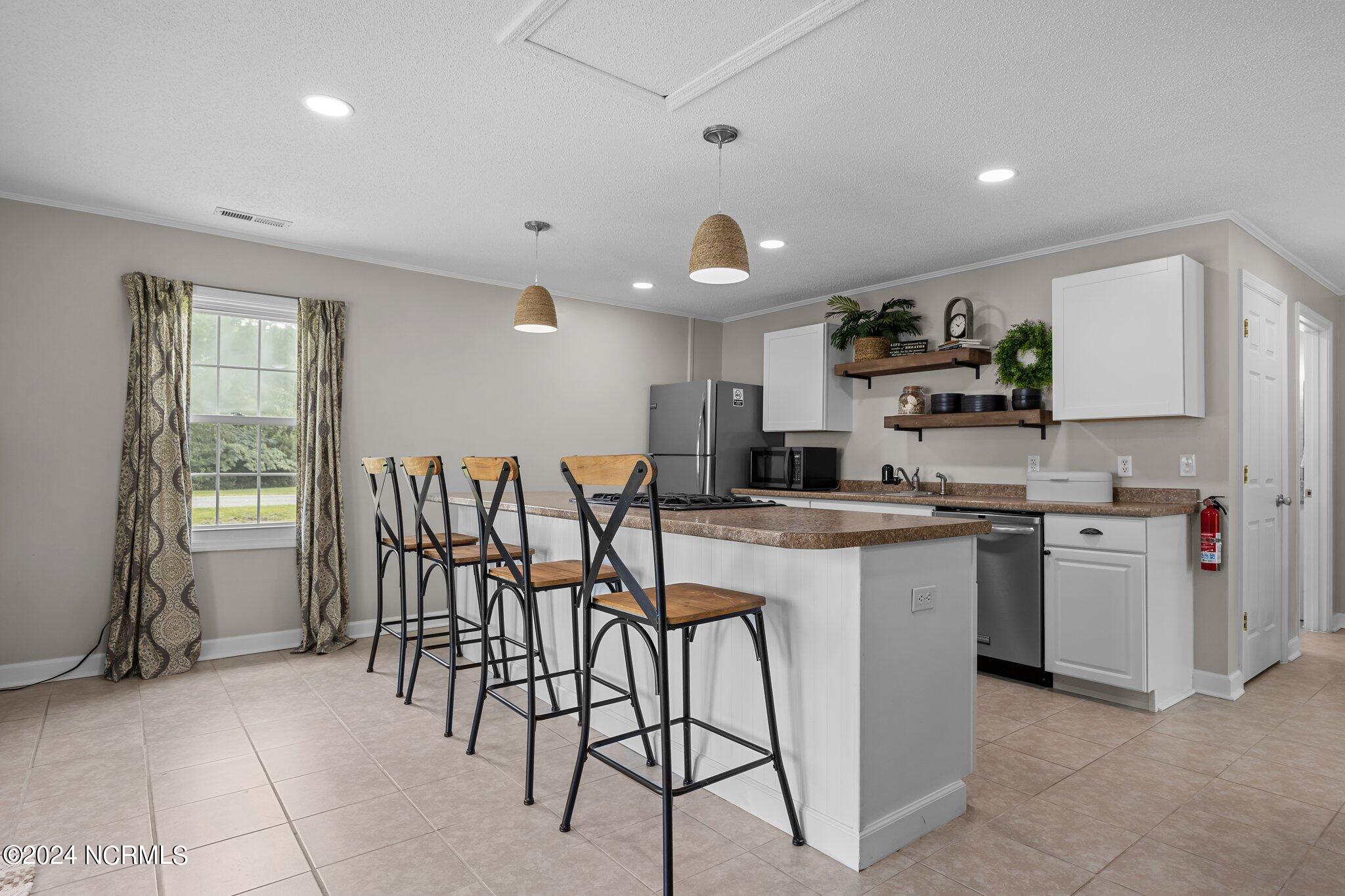263 Core Creek Road Beaufort, NC 28516 - Photo 34 of 55 bungalow kitchen island with 4 chair counter seating