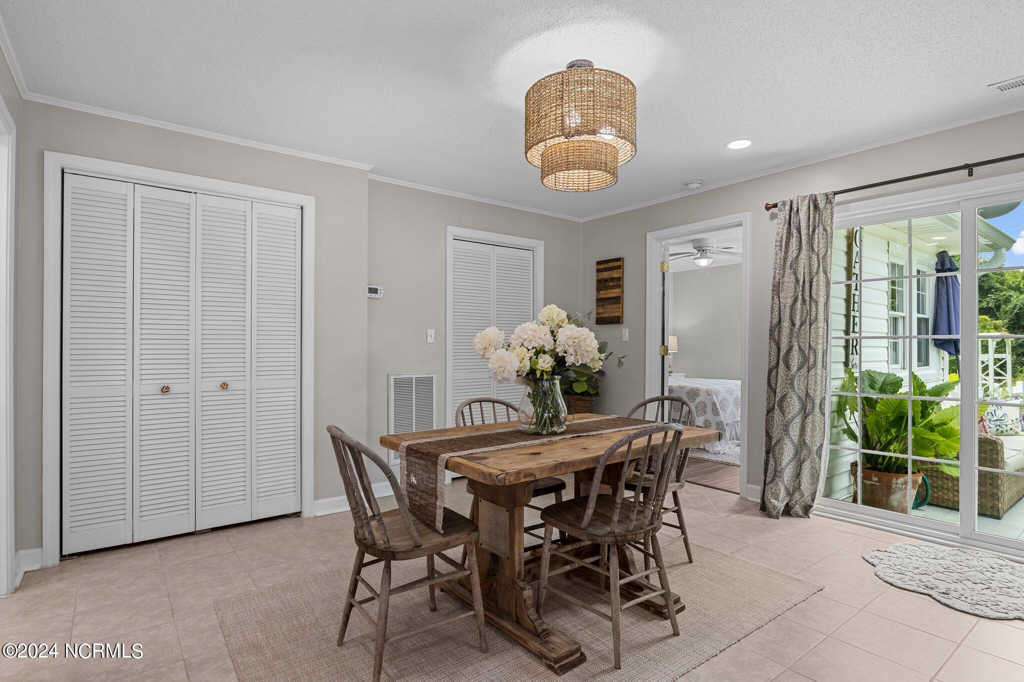 263 Core Creek Road Beaufort, NC 28516 - Photo 41 of 55 bungalow dining area with outdoor patio access