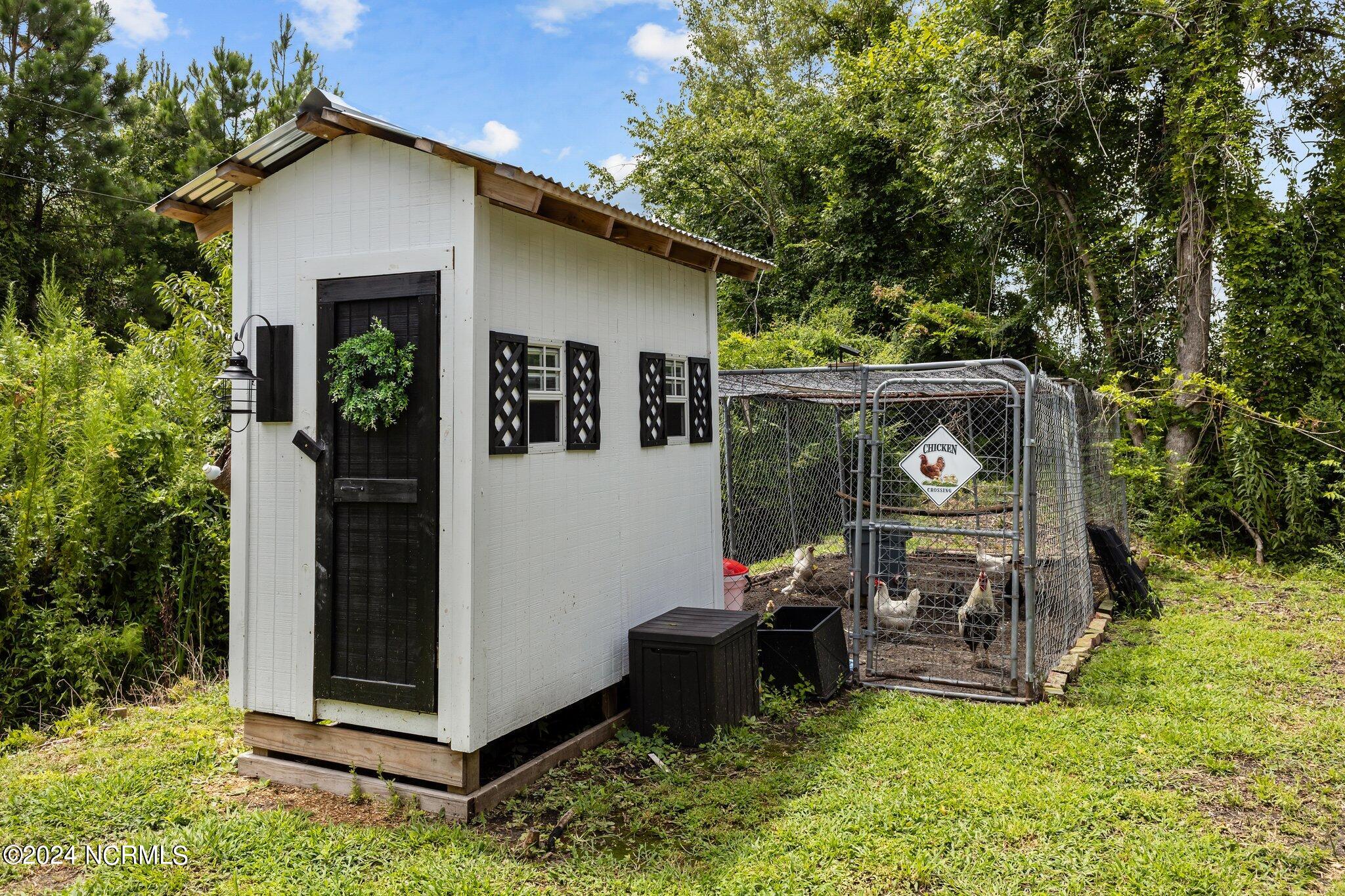 263 Core Creek Road Beaufort, NC 28516 - Photo 45 of 55 custom farmhouse style chicken coop...matches the house!