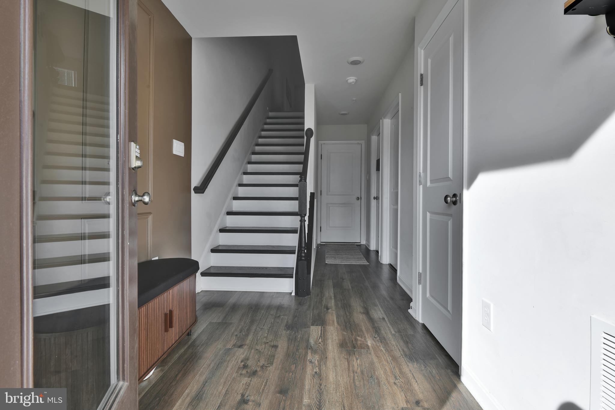 457 Tiller Street Frederick, MD 21701 - Photo 13 of 25 a view of a hallway with wooden floor and entryway