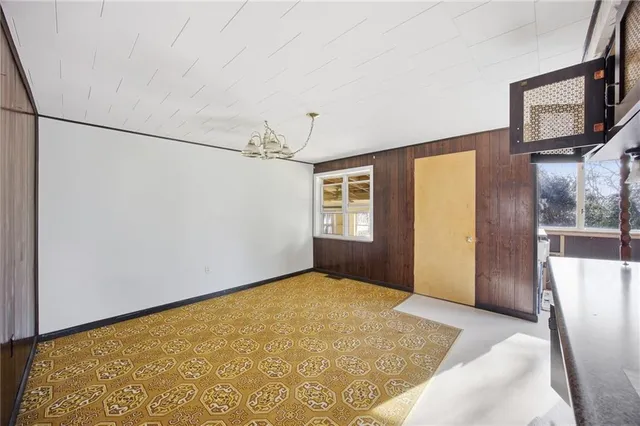 a bathroom with a tub sink and window
