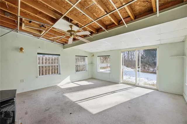 a view of an empty room with windows