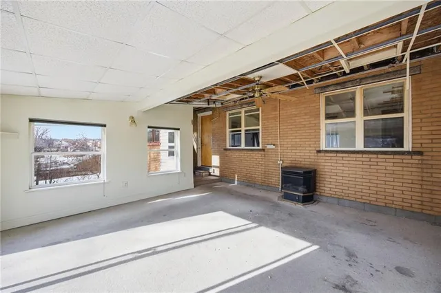 a kitchen with a sink and refrigerator