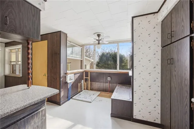 a kitchen with stainless steel appliances granite countertop a stove and a refrigerator