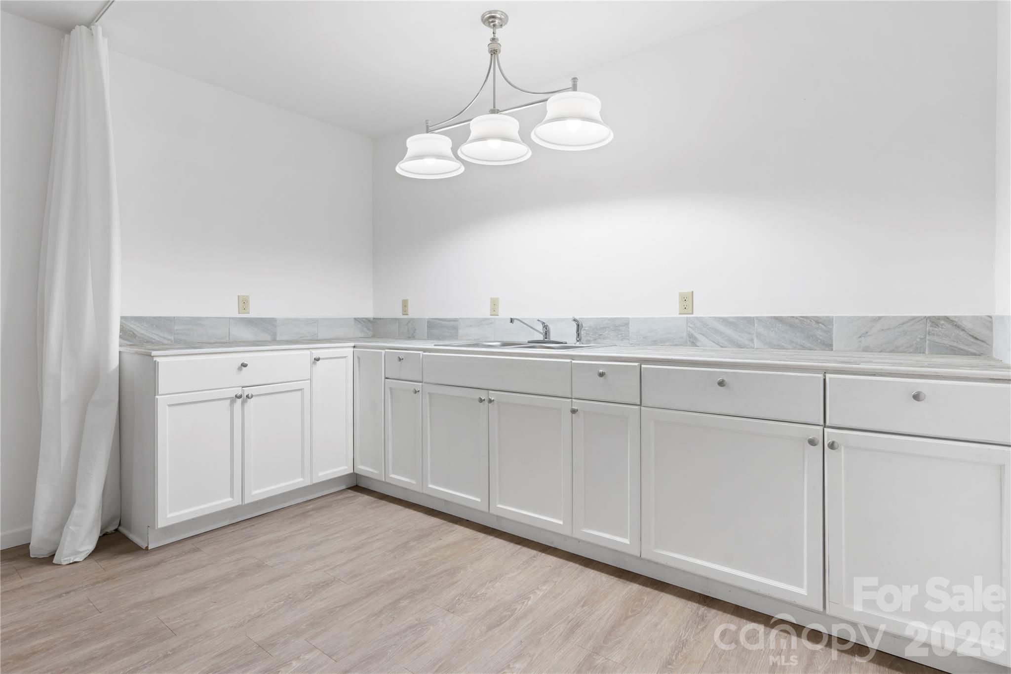 111 Pinewood Road Granite Falls, NC 28630 - Photo 25 of 33 a view of cabinets and wooden floor