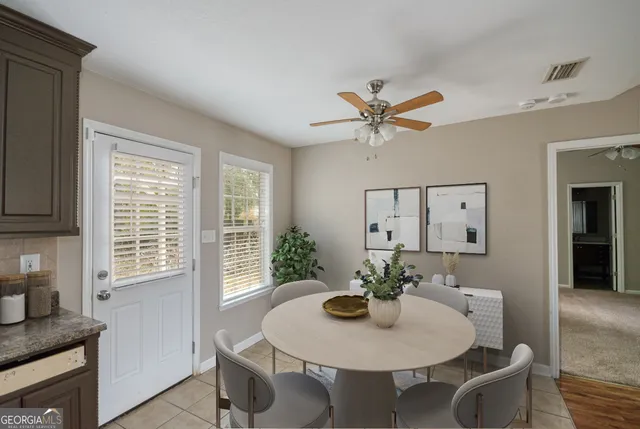 a view of a kitchen with a sink and stainless steel appliances