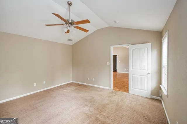 a view of an empty room with a window