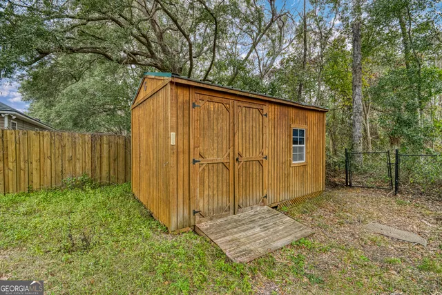 a house with trees in the background