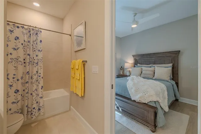 a bedroom with a bed and a mirror