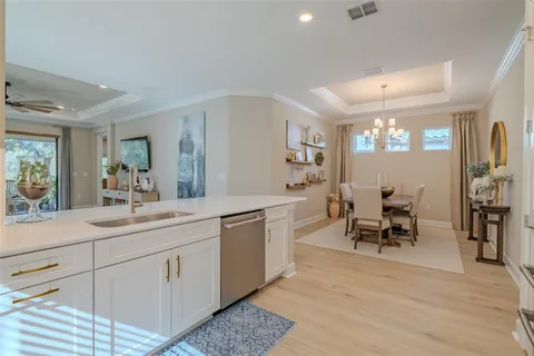 a spacious bathroom with a double vanity sink and a mirror