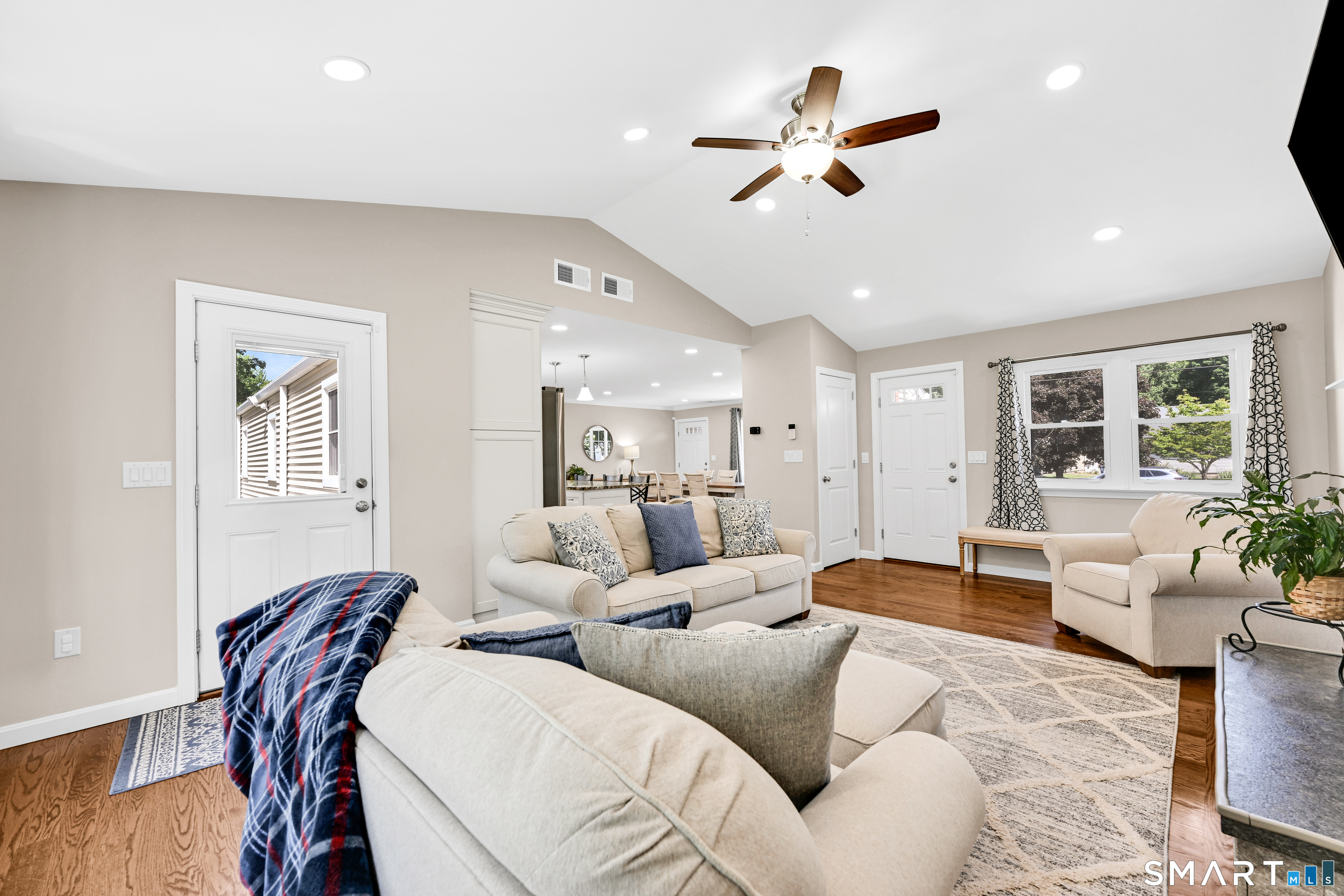 87 Lydall Road Newington, CT 06111 - Photo 9 of 35 a living room with furniture ceiling fan and a wooden floor