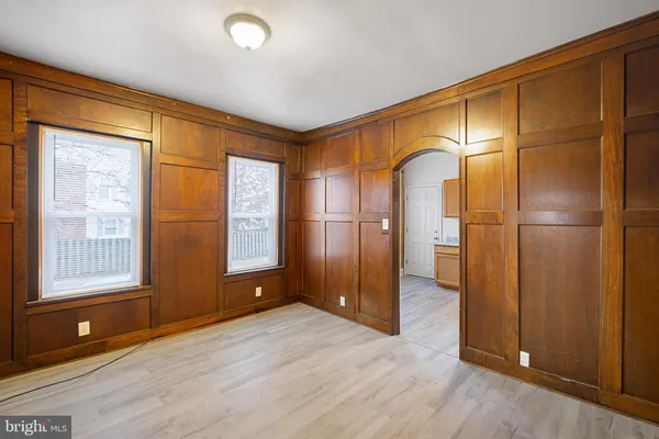 a view of entryway with wooden floor and door