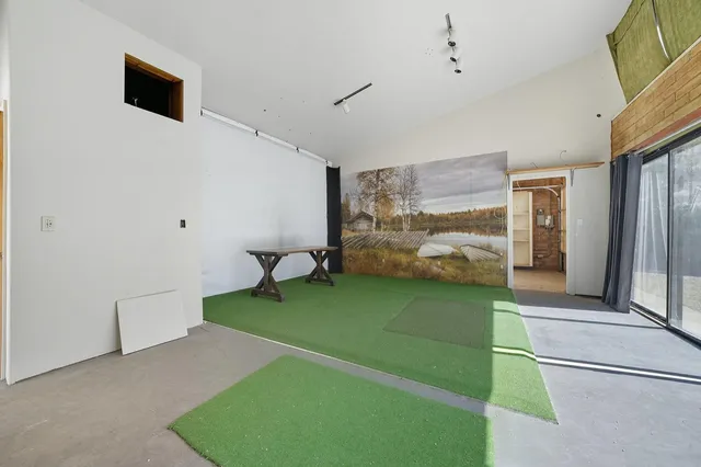 a view of a patio with table and chairs with wooden fence and plants