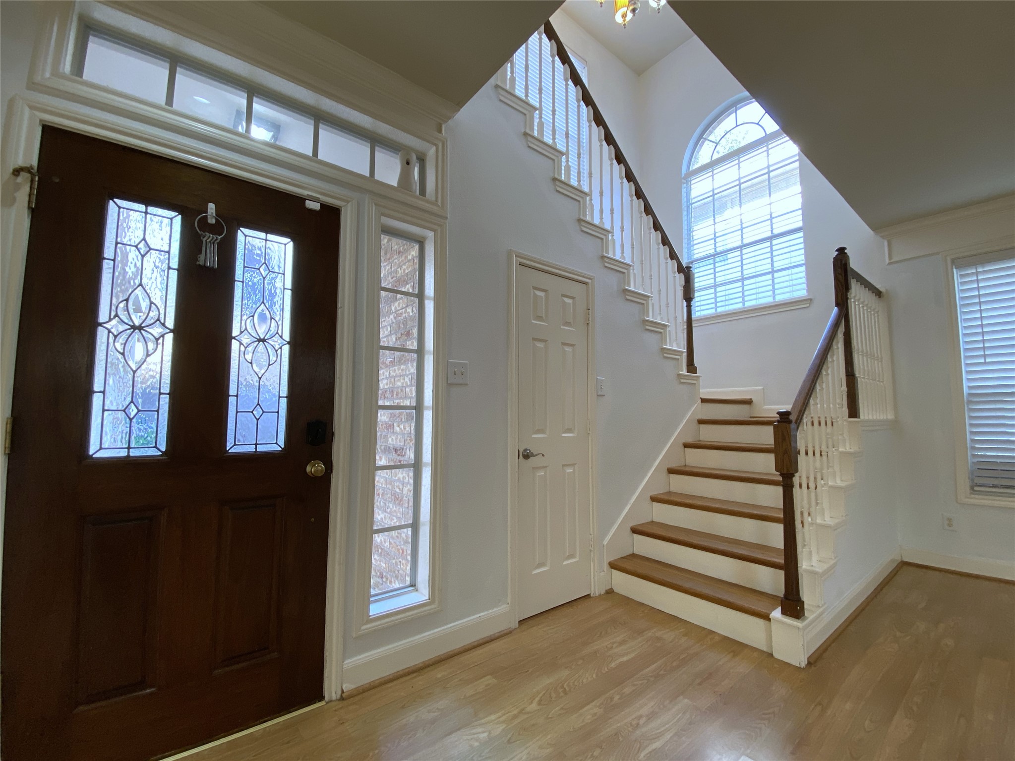 2604 Hopkins Street, Unit 1/2 Houston, TX 77006 - Photo 13 of 26 Natural light flows into the stairway to the second story from a large, arched window.