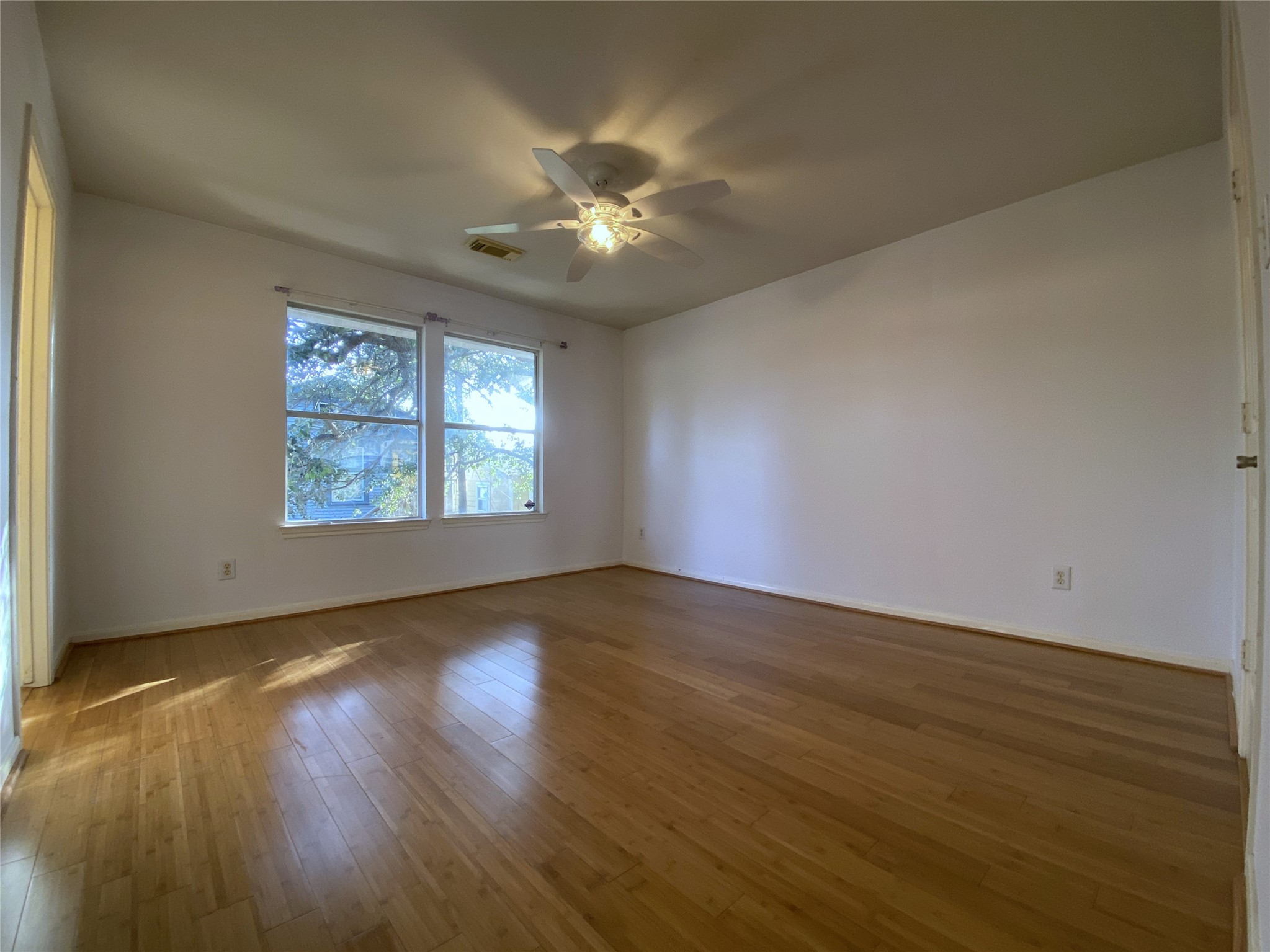 2604 Hopkins Street, Unit 1/2 Houston, TX 77006 - Photo 19 of 26 Alternate view of the second, secondary bedroom which offers a ceiling fan.