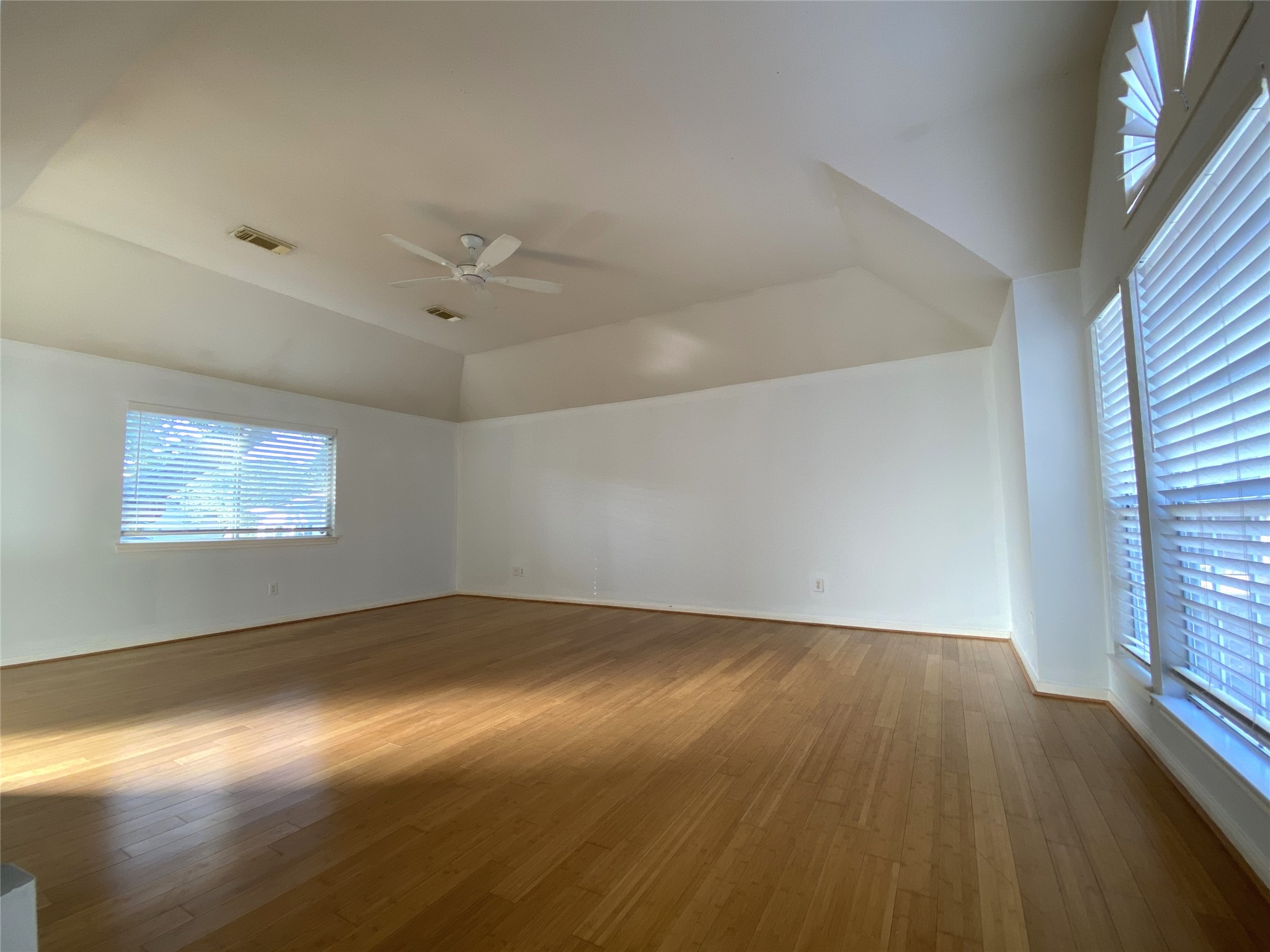 2604 Hopkins Street, Unit 1/2 Houston, TX 77006 - Photo 21 of 26 With high ceiling & ceiling fan, the primary bedroom is so spacious!