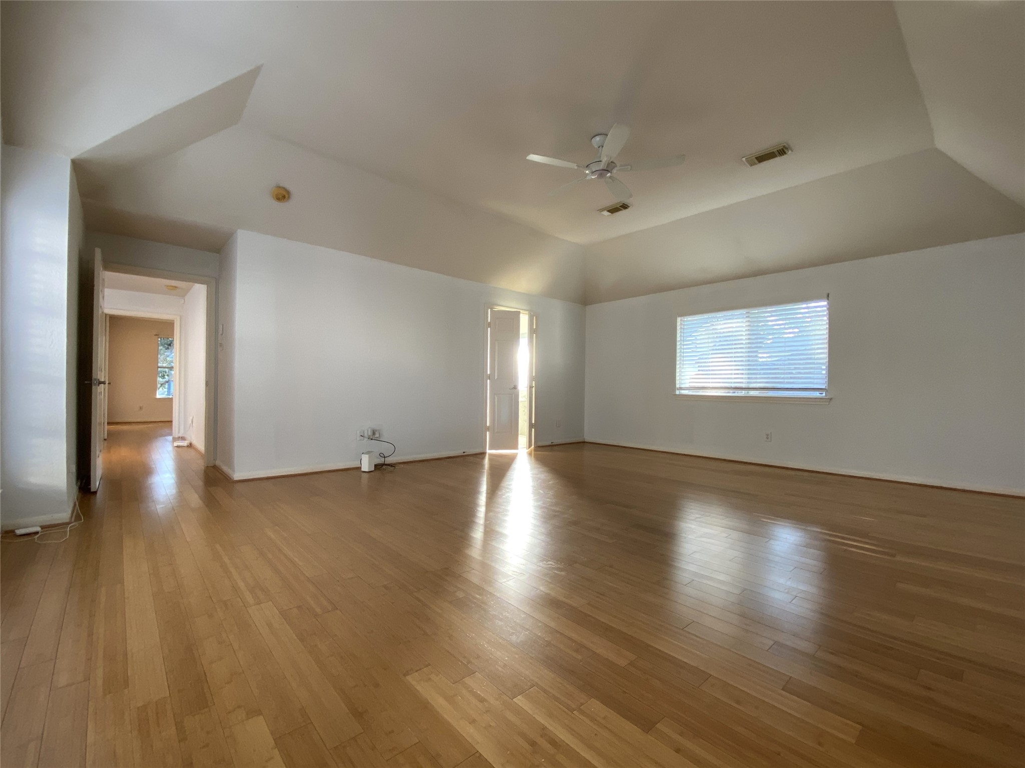 2604 Hopkins Street, Unit 1/2 Houston, TX 77006 - Photo 22 of 26 Alternate view of the primary bedroom, double doors open in from the primary bathroom.
