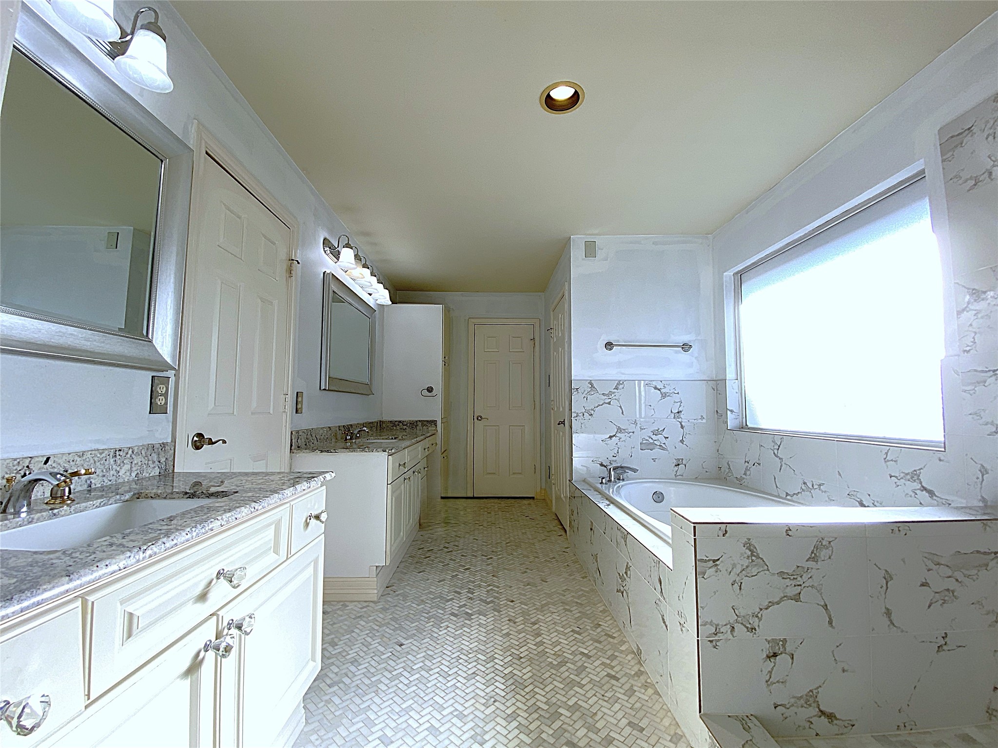 2604 Hopkins Street, Unit 1/2 Houston, TX 77006 - Photo 23 of 26 Behind each the door on the left, between the two vanities, and the door at the opposite side of the bathroom is a walk-in closet. Yes! Two walk-in closets!