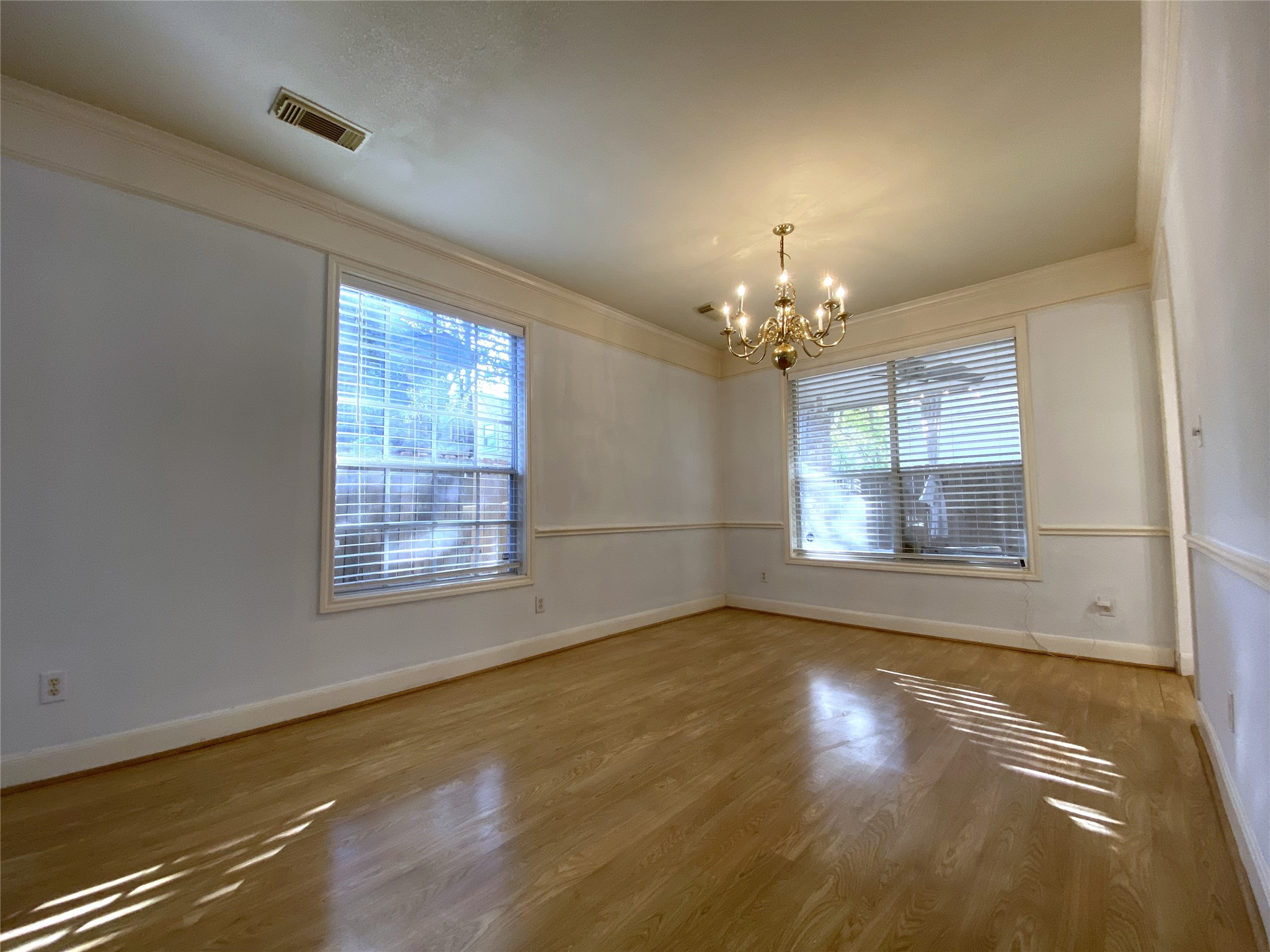 2604 Hopkins Street, Unit 1/2 Houston, TX 77006 - Photo 4 of 26 The dining room offers chair railing.