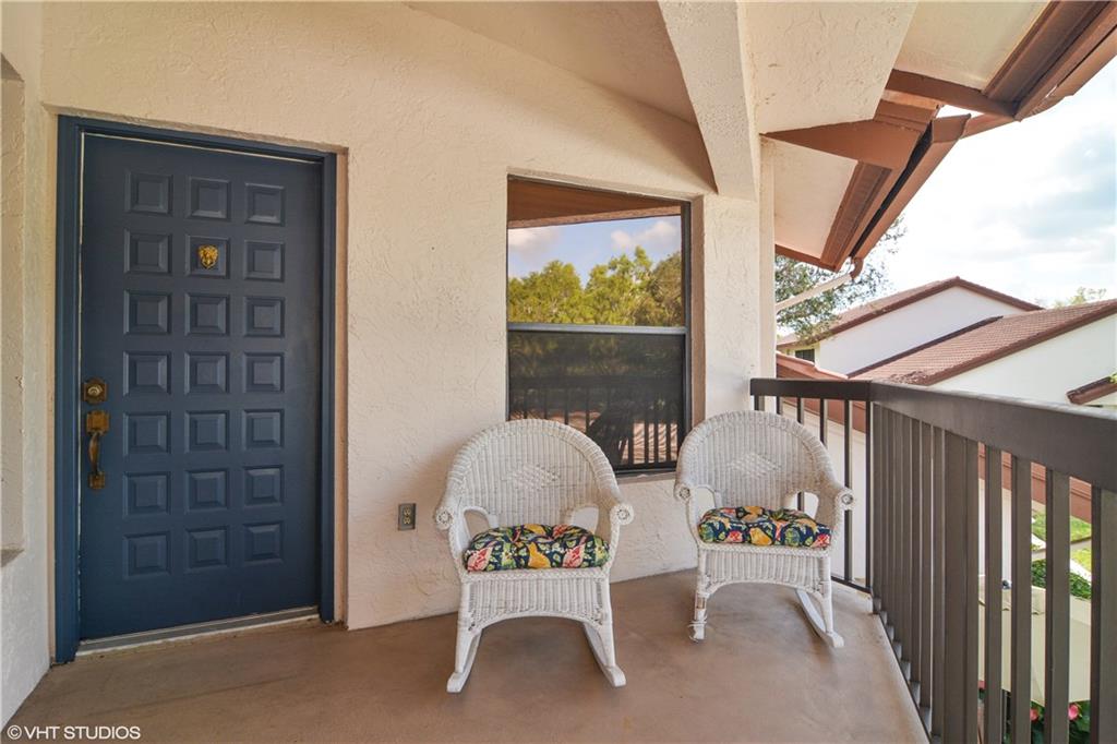 3410 Southeast Martinique Trace, Unit 202 Stuart, FL 34997 - Photo 15 of 15 a building outdoor space with seating