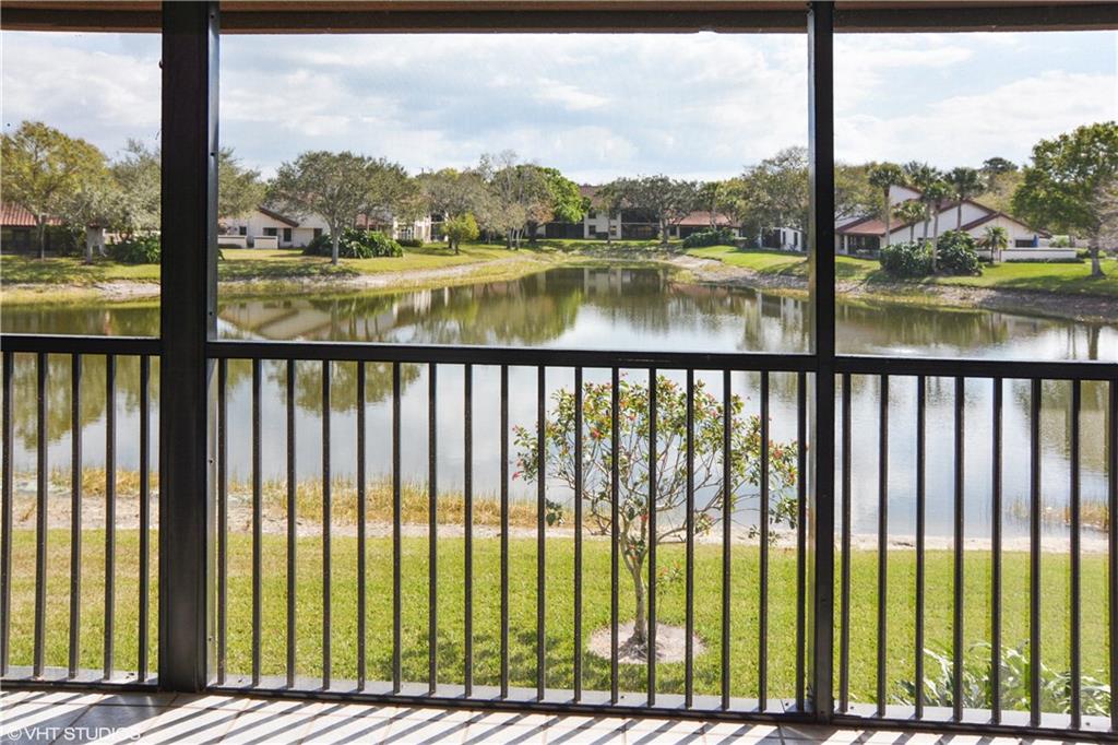 3410 Southeast Martinique Trace, Unit 202 Stuart, FL 34997 - Photo 2 of 15 a view of a lake from a balcony