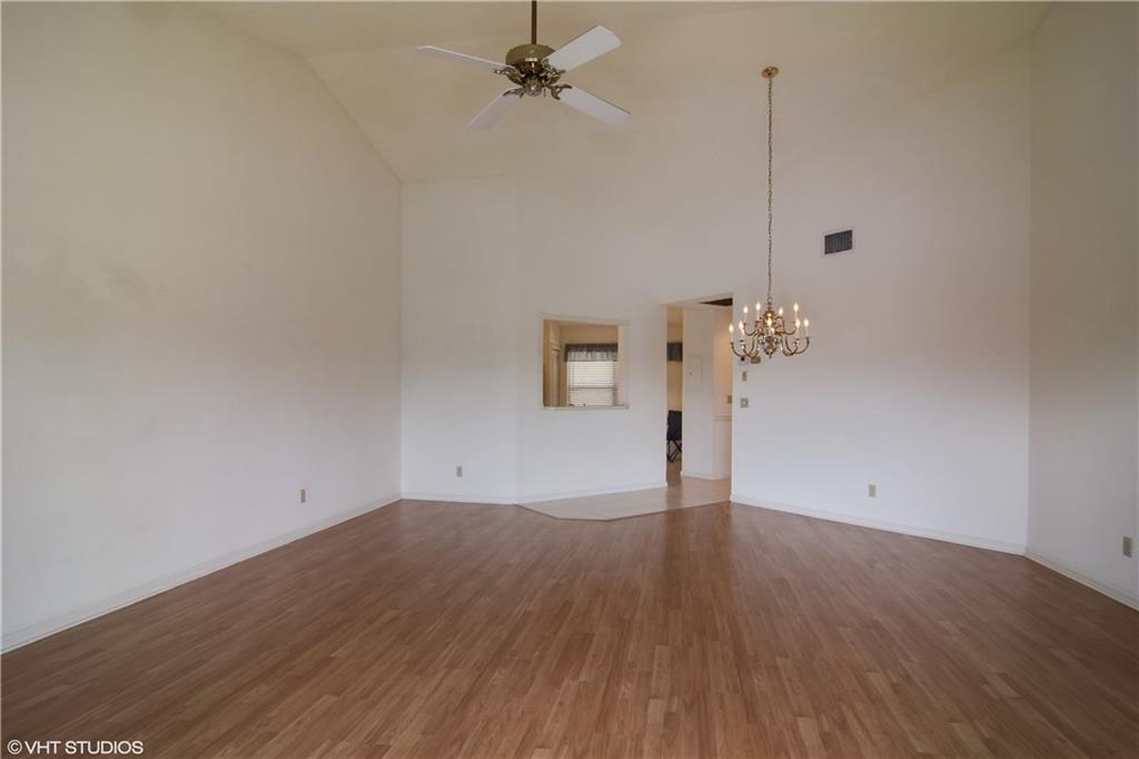 3410 Southeast Martinique Trace, Unit 202 Stuart, FL 34997 - Photo 5 of 15 a view of an empty room with wooden floor