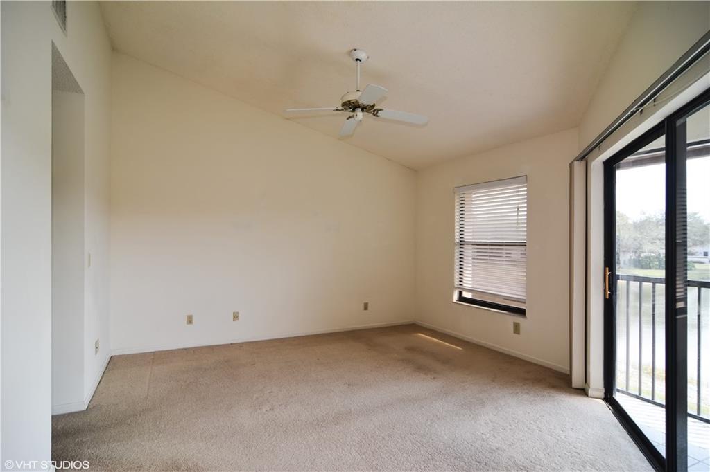 3410 Southeast Martinique Trace, Unit 202 Stuart, FL 34997 - Photo 10 of 15 an empty room with windows