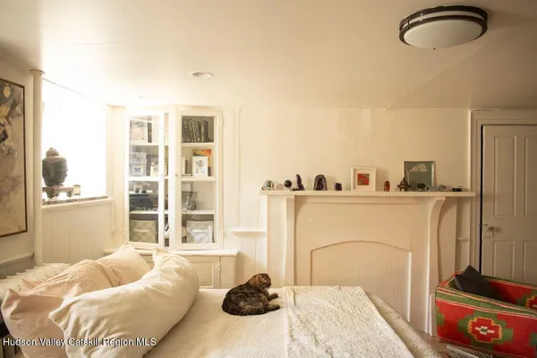 a bedroom with a large bed and a window