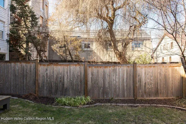 a view of a backyard of the house