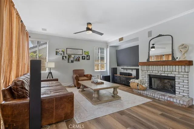 a kitchen with refrigerator a sink and chairs