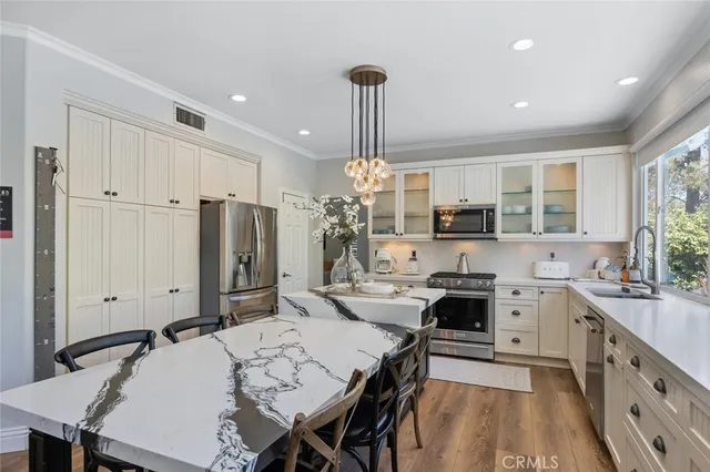 a room with wooden floor and pool table