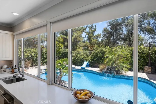 a utility room with sink dryer and washer