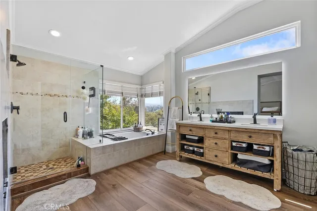 a view of a backyard with plants and tree