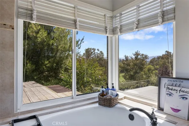 a bathroom with a toilet a sink and shower