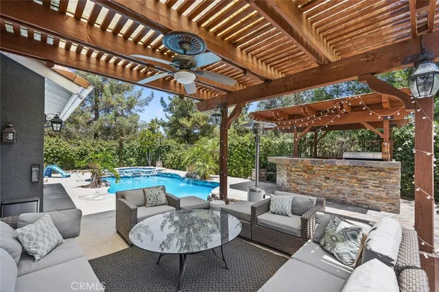 a view of a backyard with plants and patio