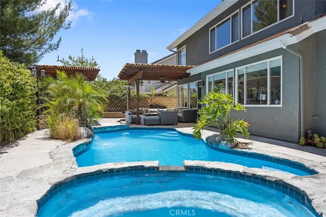 a view of swimming pool with seating space