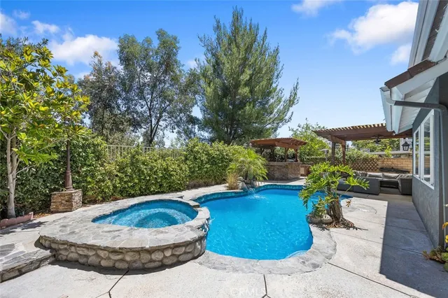 a view of a patio with table and chairs and potted plants