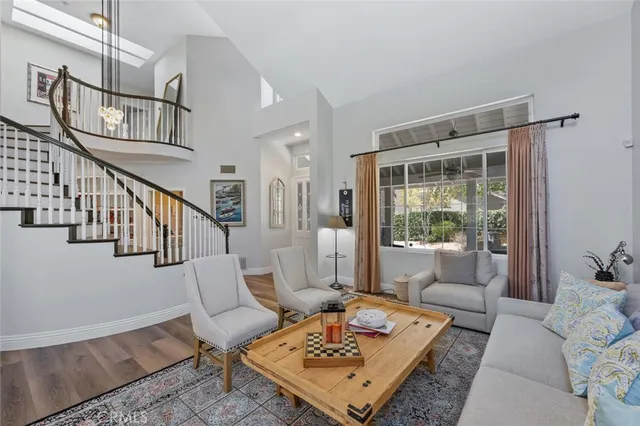 a view of a dining room with furniture wooden floor and chandelier