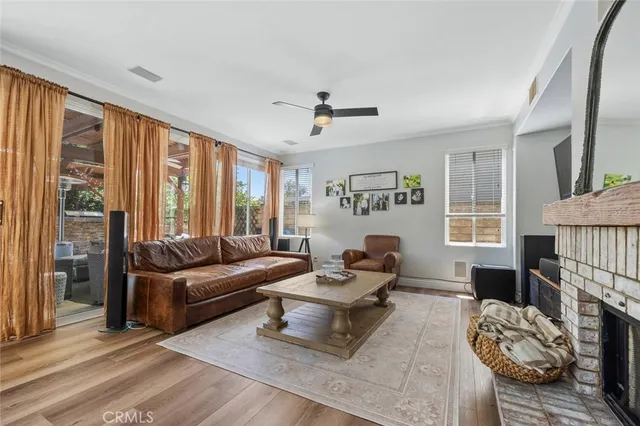a living room with furniture fireplace and flat screen tv